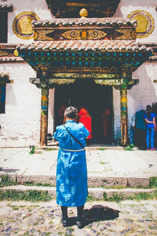 Woman praying at Erdene Zuu